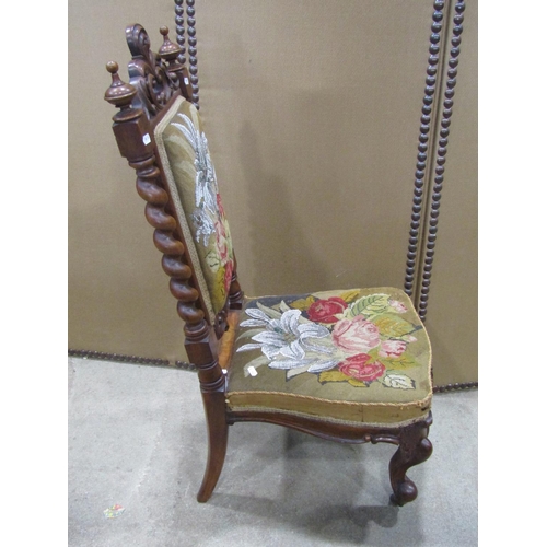 1247 - Victorian nursing chair with floral tapestry upholstered seat and back within a showwood frame raise... 