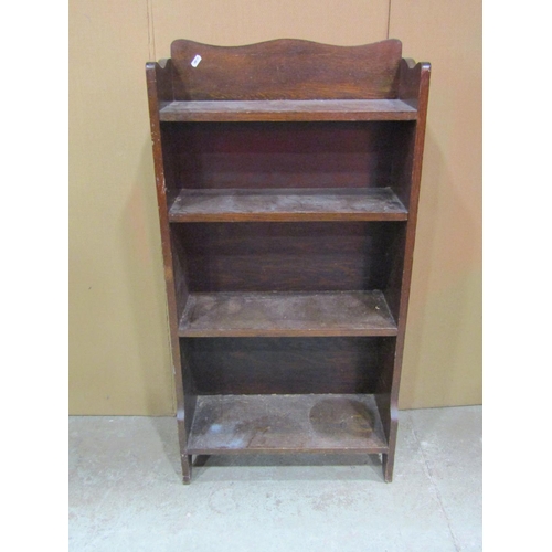 1292 - A small oak freestanding open bookcase with shaped outline and fixed shelves, 104 cm high x 54 cm wi... 