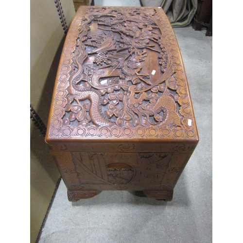 1294 - An Eastern domed top camphor wood coffer/chest with profusely carved detail, 63 cm high x 110 cm lon... 