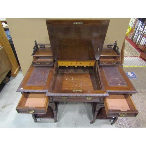 1342 - An Edwardian walnut Dickens type desk fitted with an arrangement of drawers, flanking and surmountin... 