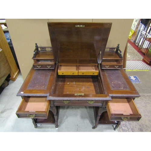 1342 - An Edwardian walnut Dickens type desk fitted with an arrangement of drawers, flanking and surmountin... 