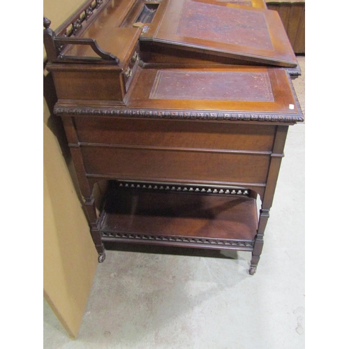 1342 - An Edwardian walnut Dickens type desk fitted with an arrangement of drawers, flanking and surmountin... 