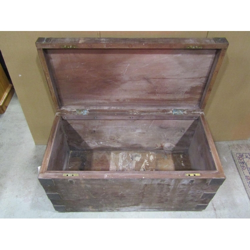 1071 - A heavy teak? or possibly pitch pine strongbox with hinged lid, twin lock and overlaid corner bracke... 