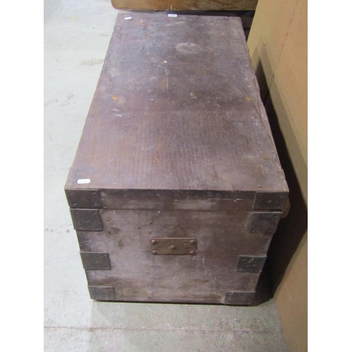 1071 - A heavy teak? or possibly pitch pine strongbox with hinged lid, twin lock and overlaid corner bracke... 