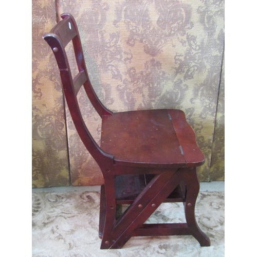 1145 - A contemporary reproduction stained hardwood bar back Metamorphic library chair/steps