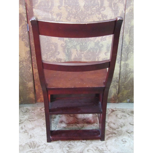 1145 - A contemporary reproduction stained hardwood bar back Metamorphic library chair/steps