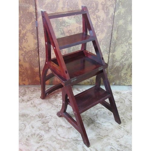 1145 - A contemporary reproduction stained hardwood bar back Metamorphic library chair/steps