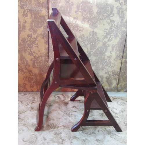 1145 - A contemporary reproduction stained hardwood bar back Metamorphic library chair/steps