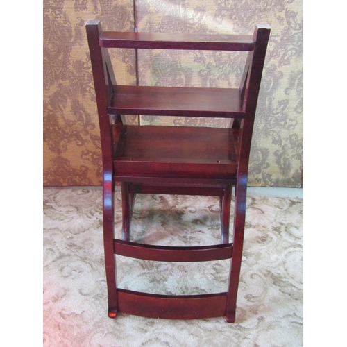 1145 - A contemporary reproduction stained hardwood bar back Metamorphic library chair/steps