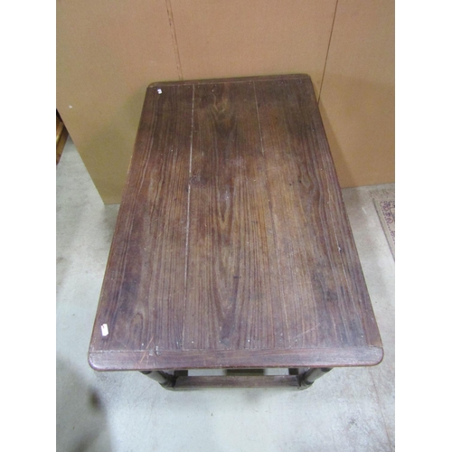 1153 - An antique oak stained pine side table, the plank top with cleated ends over a frieze drawer and tur... 