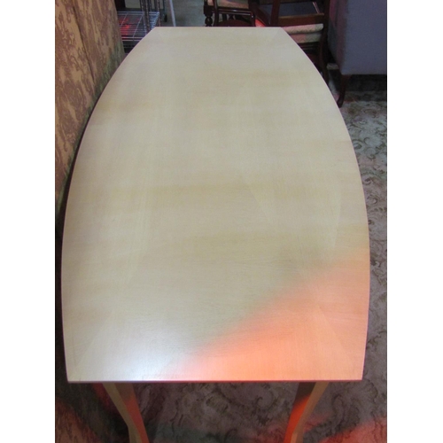 1241 - A contemporary dining table  with shaped outline and angular tapered supports, 75 cm high x 180 cm l... 