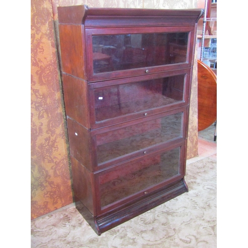 1267 - A Globe Wernicke style four sectional floorstanding library bookcase enclosed by rectangular glazed ... 