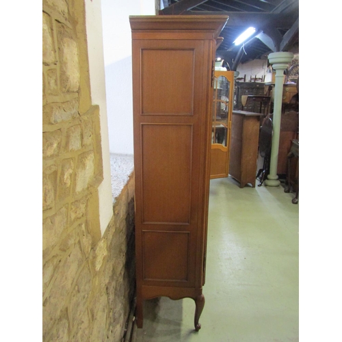 1281 - A continental shallow breakfront freestanding side cabinet enclosed by four glazed and moulded panel... 