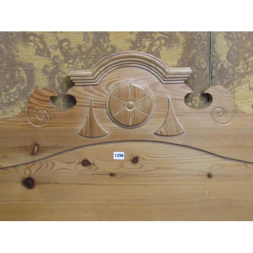 1296 - A stripped pine double bedstead with turned finials and arched and moulded headboard (complete with ... 