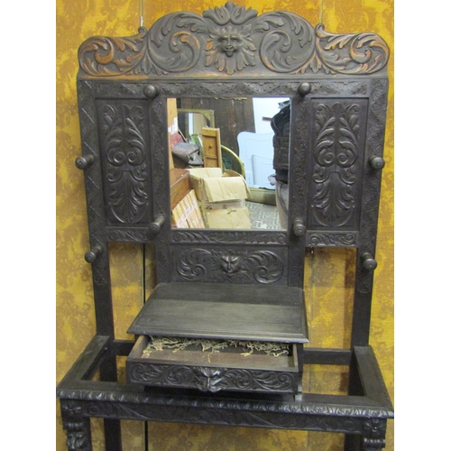 1313 - A Victorian gothic carved oak hallstand with carved lions mask, green man and scrolling acanthus det... 