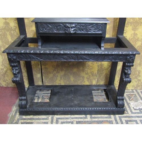 1313 - A Victorian gothic carved oak hallstand with carved lions mask, green man and scrolling acanthus det... 