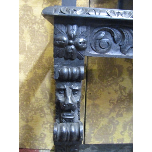 1313 - A Victorian gothic carved oak hallstand with carved lions mask, green man and scrolling acanthus det... 