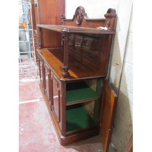 1357 - A Victorian mahogany buffet, the lower section enclosed by three panelled doors, turned columns and ... 