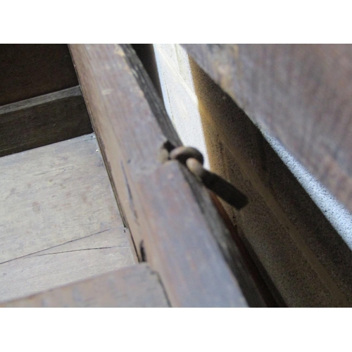 1370 - 18th century oak panelled coffer with carved frieze and geometric dog tooth inlay, 116cm long