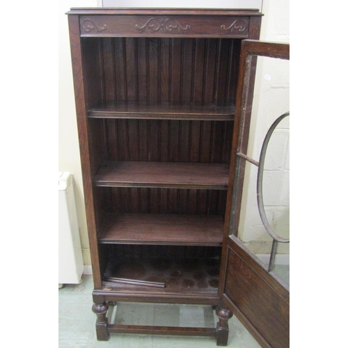 1396 - Edwardian oak side table in a Jacobean style, with canted corners enclosing a frieze drawer on bobbi... 