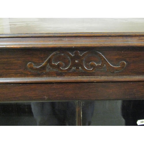 1396 - Edwardian oak side table in a Jacobean style, with canted corners enclosing a frieze drawer on bobbi... 