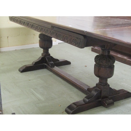 1398 - Old English style oak draw leaf refectory table raised on a pair of carved baluster supports united ... 