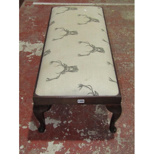 1366 - A foot stool with repeating stag pattern upholstered top raised on cabriole supports 100cm long