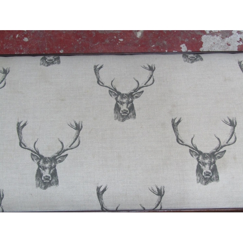 1366 - A foot stool with repeating stag pattern upholstered top raised on cabriole supports 100cm long