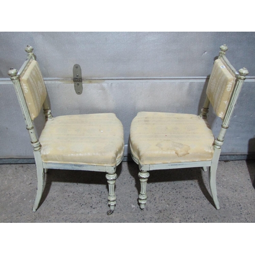 1378 - A pair of French side chairs with painted frames upholstered seats and backs