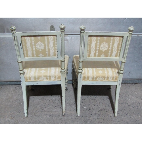 1378 - A pair of French side chairs with painted frames upholstered seats and backs