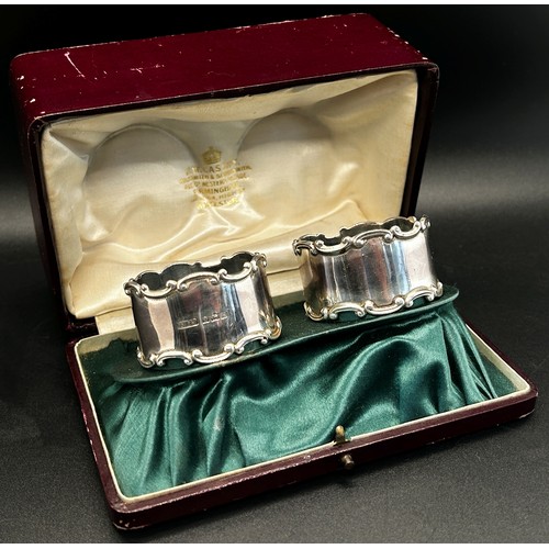 263 - A leather cased set of four matching silver napkin rings, late Victorian, Birmingham 1899, maker mak... 