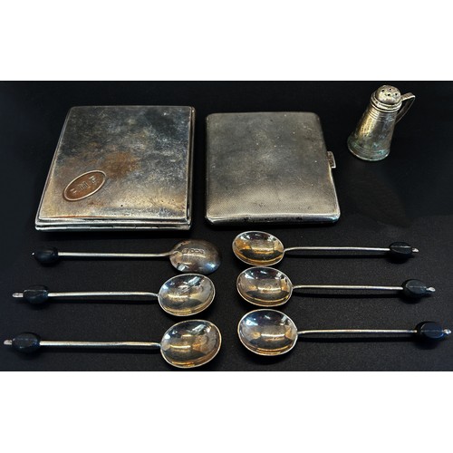 290 - A cased set of six silver coffee spoons, two cigarette cases, one stamped 800 and a pepperette, 6 oz... 