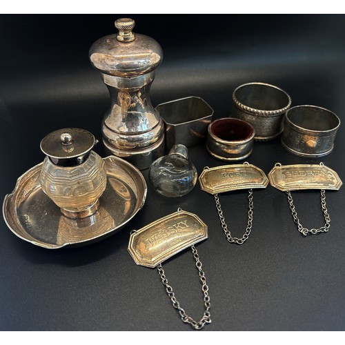 297 - Three silver drinks labels, four napkin rings, salt mill, two glass bottles, 5.5 oz approx (10)