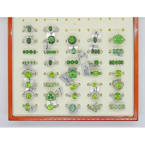 426 - Collection of green gem set silver dress rings, to include peridot, flourite, apatite, topaz, green ... 