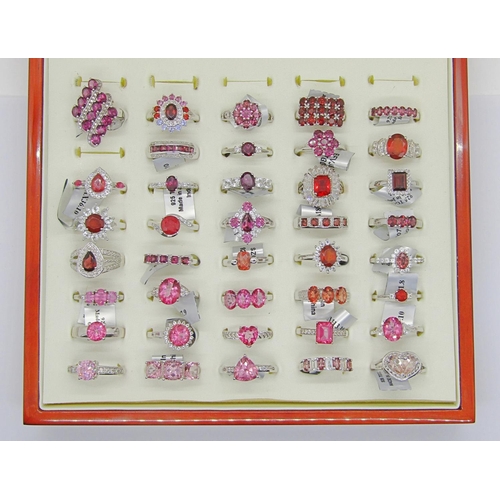 427 - Collection of red - pink gem set silver dress rings, to include ruby, pink sapphire, garnet, tourmal... 