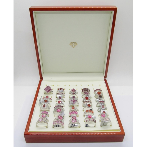 427 - Collection of red - pink gem set silver dress rings, to include ruby, pink sapphire, garnet, tourmal... 