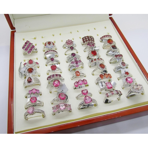 427 - Collection of red - pink gem set silver dress rings, to include ruby, pink sapphire, garnet, tourmal... 