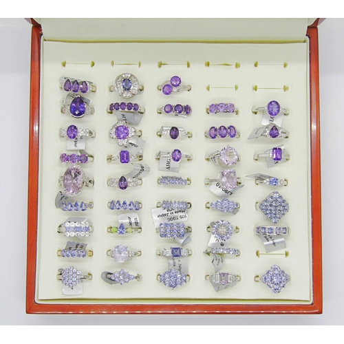 428 - Collection of purple - violet gem set silver dress rings, to include amethyst, tanzanite, opal, quar... 