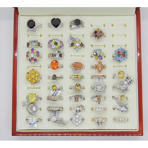 430 - Collection of gem set silver dress rings, to include several multi gem rainbow cluster examples, wit... 