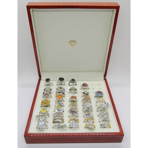 430 - Collection of gem set silver dress rings, to include several multi gem rainbow cluster examples, wit... 