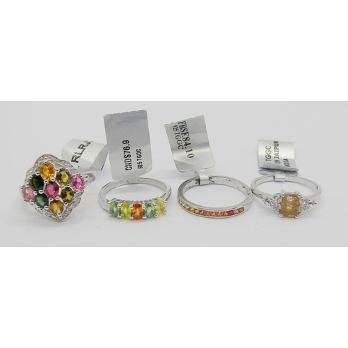 430 - Collection of gem set silver dress rings, to include several multi gem rainbow cluster examples, wit... 