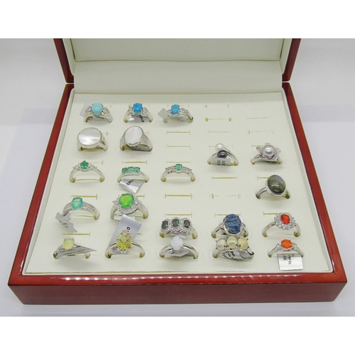 431 - Collection of gem set silver dress rings, to include several opal examples, fire opal, pearl, labrad... 