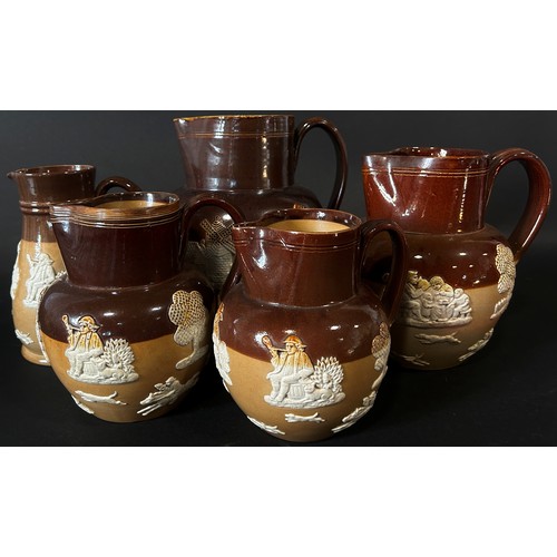 123 - Collection of Doulton stoneware jugs with applied detail in varying sizes (12)