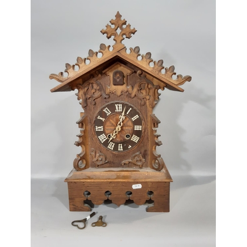 530 - A 19th century Tyrolean bracket cuckoo clock, the casework in the form of a chalet with cuckoo and g... 