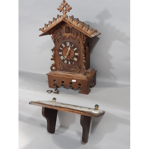 530 - A 19th century Tyrolean bracket cuckoo clock, the casework in the form of a chalet with cuckoo and g... 