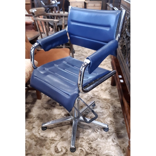 1258 - A vintage barbers/hairdressers chair with polished chrome framework and blue upholstery