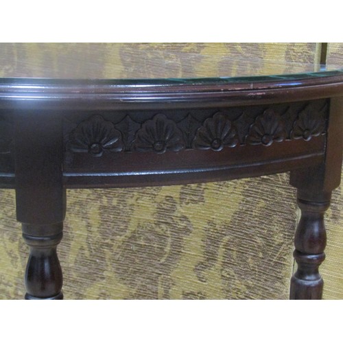 1204 - A cross-banded demi-lune mahogany hall table, 76cm high, 91 cm wide