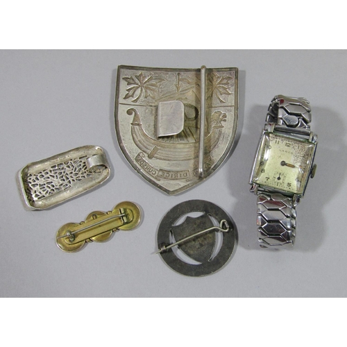 433 - Collection of costume jewellery to include a University College Hospital white metal nurses buckle w... 