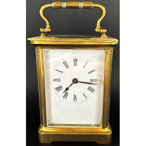 511 - Brass carriage clock with enamelled dial and eight day timepiece