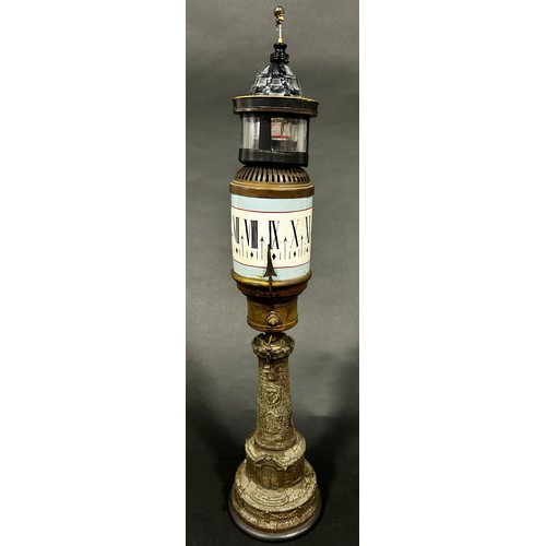 528 - French lighthouse clock with rotating painted ceramic cylinder dial on column with beacon, dome and ... 